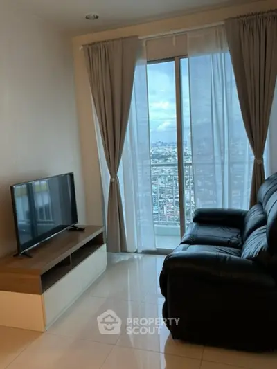 Modern living room with leather sofa and city view balcony