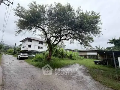 Charming rural property with lush greenery and spacious surroundings, perfect for serene living.