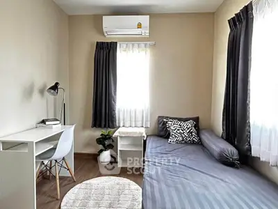Cozy minimalist bedroom with natural light and modern decor