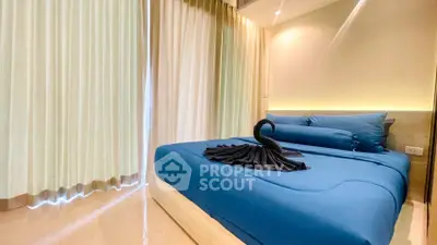 Luxurious bedroom with elegant blue bedding and ambient lighting