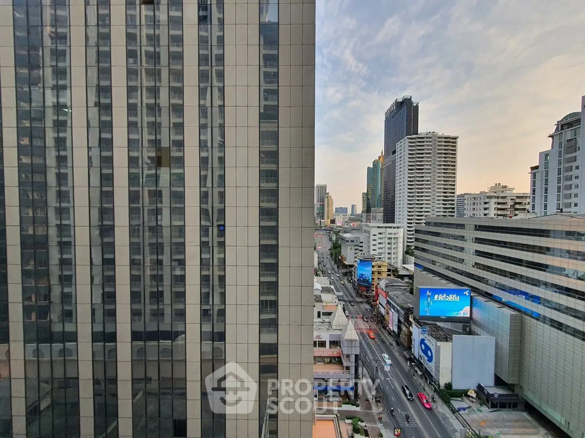 Stunning cityscape view from a high-rise building, showcasing urban architecture and bustling streets below.