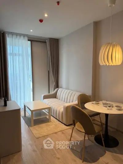 Modern living room with cozy seating and elegant lighting