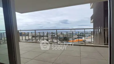 Spacious balcony with panoramic city views, perfect for relaxation and entertainment.