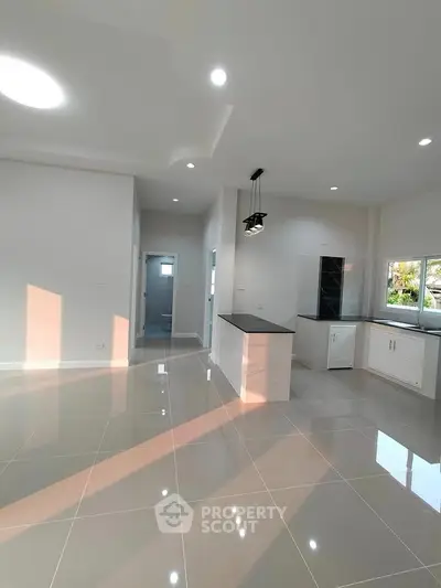 Modern kitchen with sleek design and ample natural light