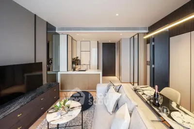 Luxurious modern living room with open kitchen, elegant decor, and stylish furniture in a high-end apartment.