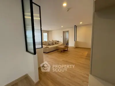 Spacious modern living room with wooden flooring and stylish decor