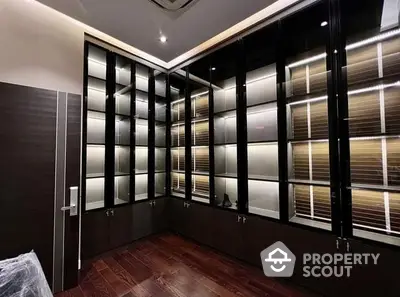 Luxurious modern study with elegant built-in shelving and ambient lighting