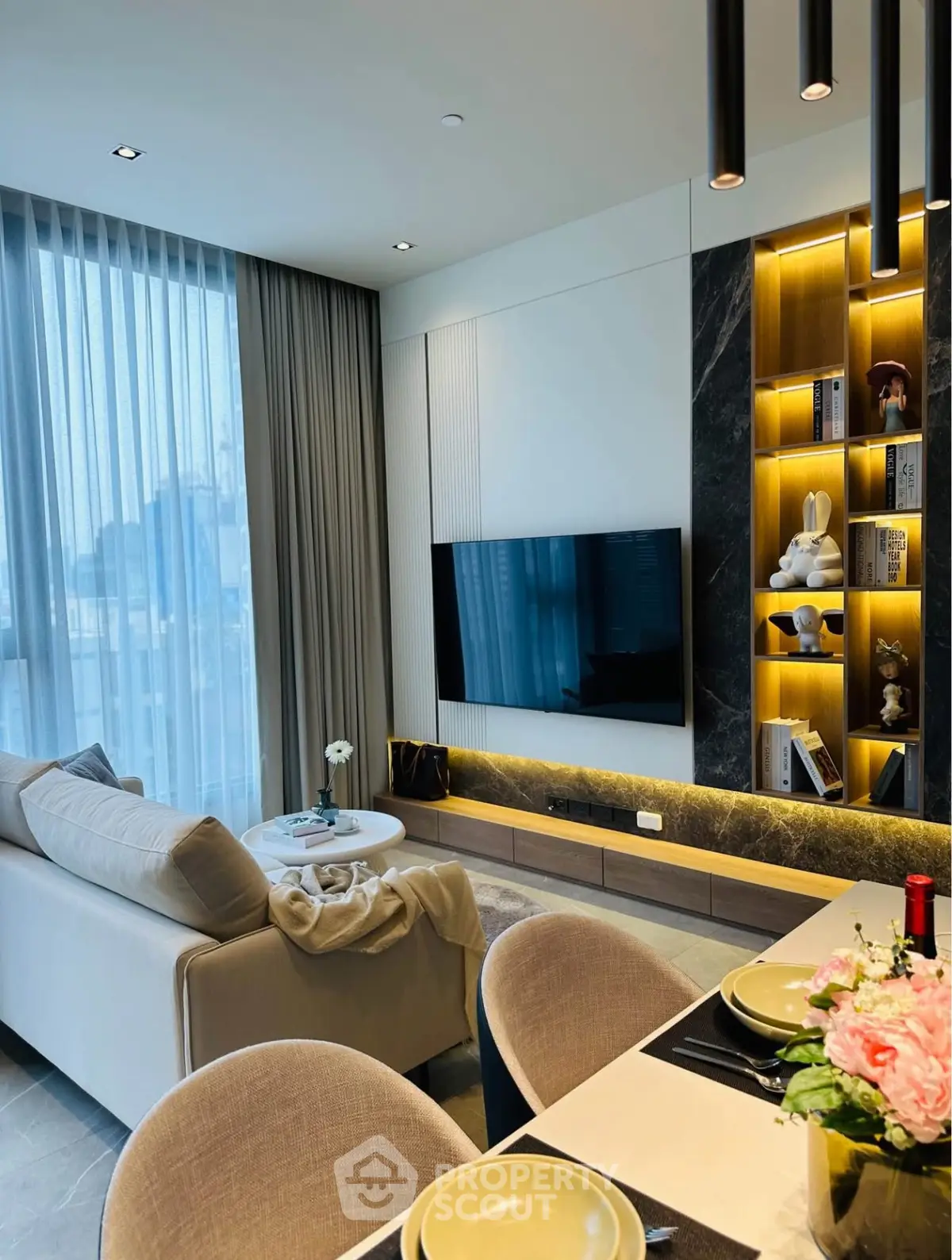 Modern living room with elegant decor and built-in shelving