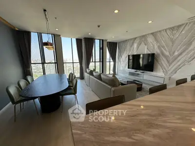 Luxurious modern living room with panoramic city view and elegant dining area.