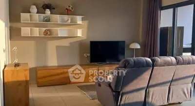 Modern living room with cozy sofa and sleek TV setup