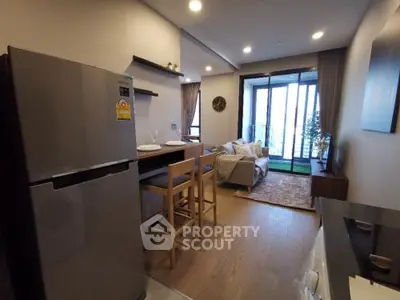 Modern open-layout kitchen and living room with balcony view