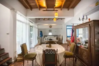 Charming living room with vintage furniture and wooden ceiling beams