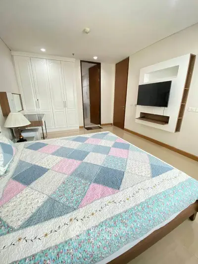 Spacious bedroom with modern decor and built-in wardrobe