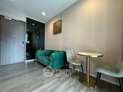 Modern living room with elegant green sofa and stylish decor