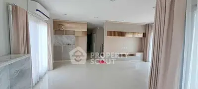 Spacious modern living room with sleek design and ample natural light