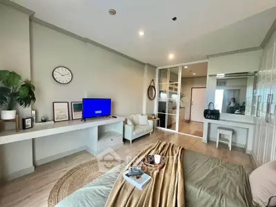 Spacious modern bedroom with cozy decor and natural light