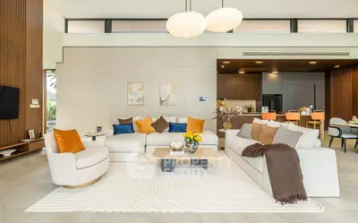 Luxurious modern living room with elegant decor and open kitchen layout
