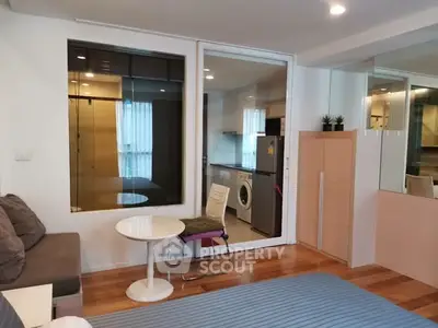 Modern living room with washing machine and stylish decor
