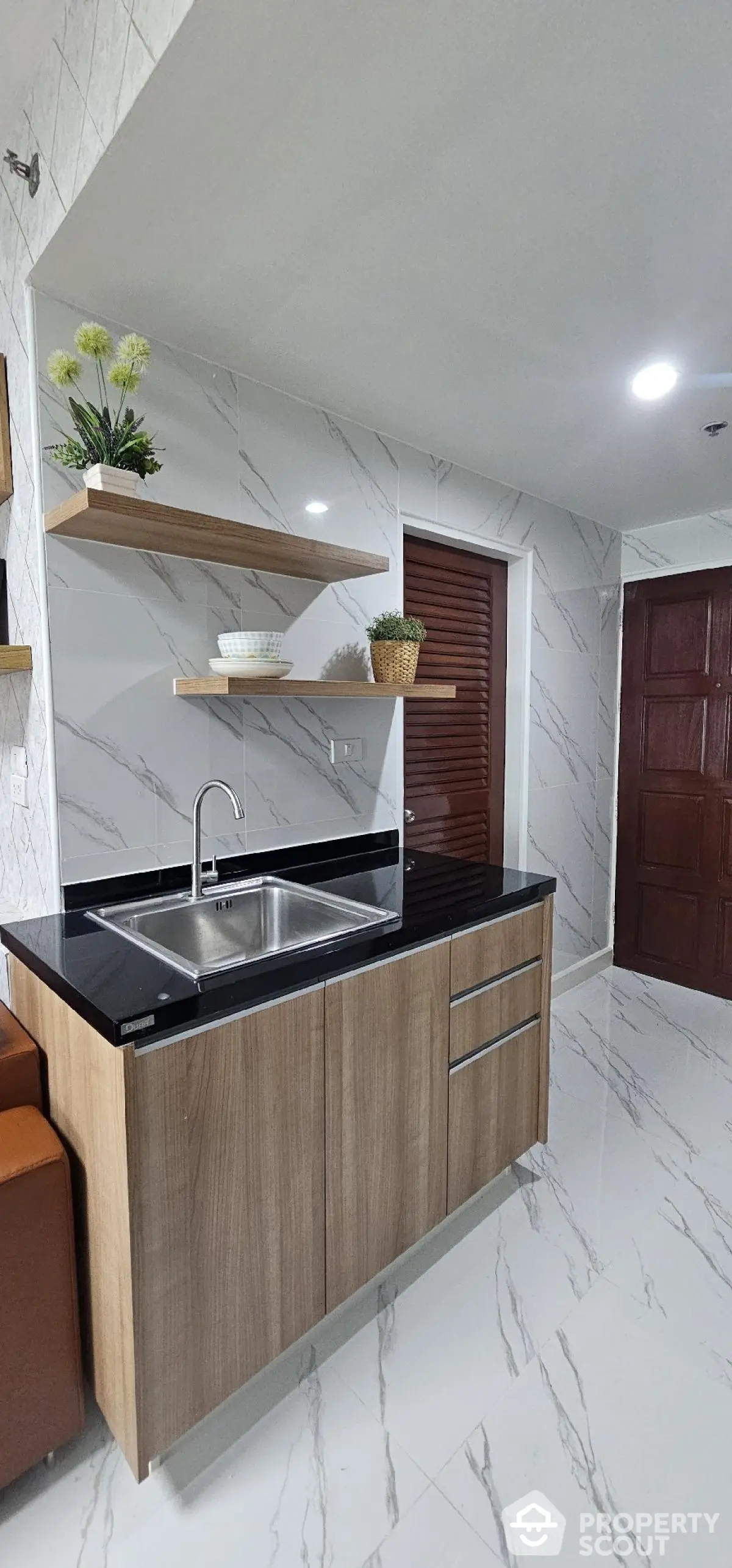 Modern kitchen with sleek cabinetry and stylish open shelves