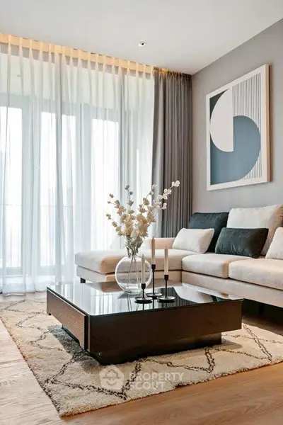 Elegant living room with modern decor, large windows, and stylish furniture.
