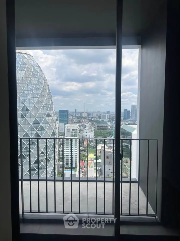 Stunning cityscape view from modern apartment balcony with iconic architecture.