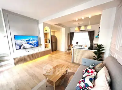 Spacious modern living room with open kitchen and stylish decor
