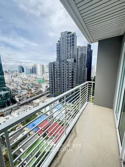 Stunning city view from a modern high-rise balcony, perfect for urban living.