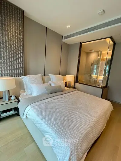 Luxurious bedroom with modern decor and ensuite bathroom view
