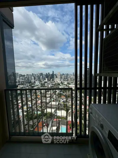 Stunning city view from high-rise balcony with washing machine