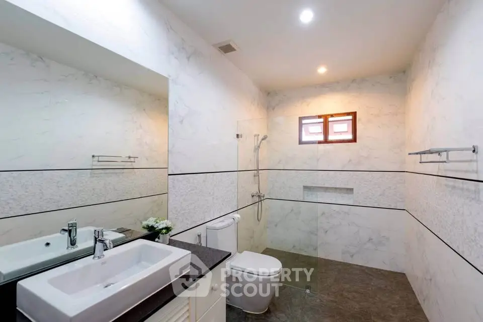 Modern bathroom with sleek design and glass shower enclosure
