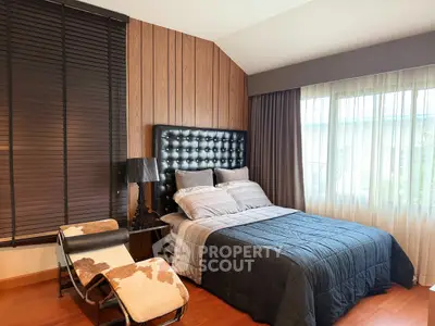 Luxurious bedroom with stylish decor and natural light