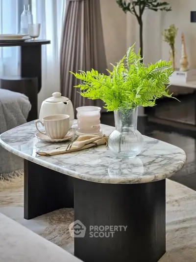 Elegant living room with marble coffee table and stylish decor