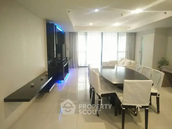 Spacious modern living room with elegant dining area and natural light