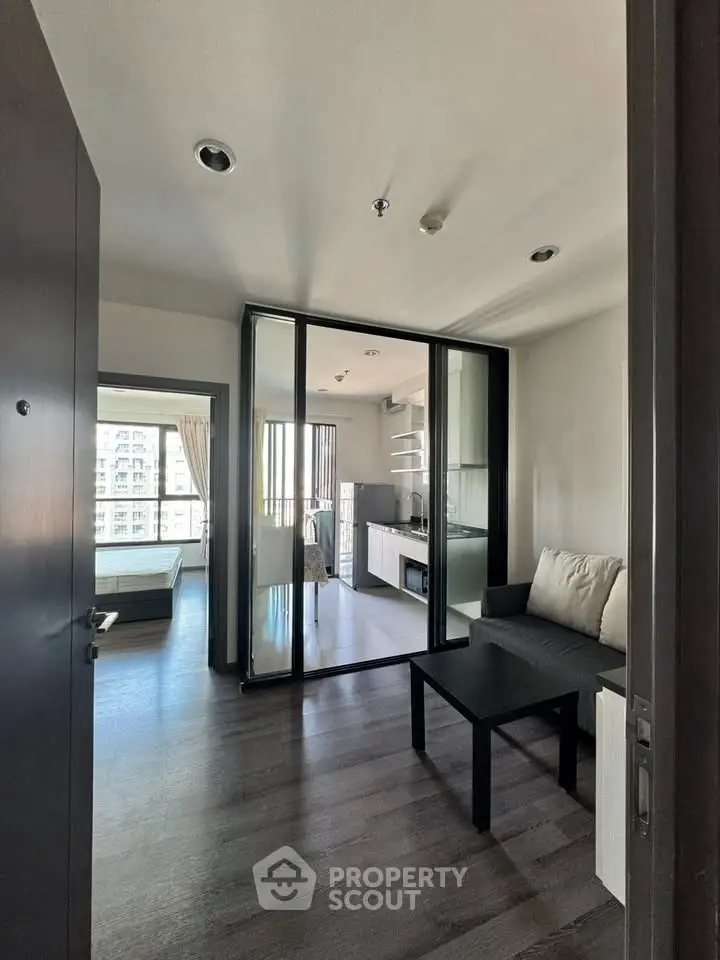 Modern apartment interior with open layout and balcony view