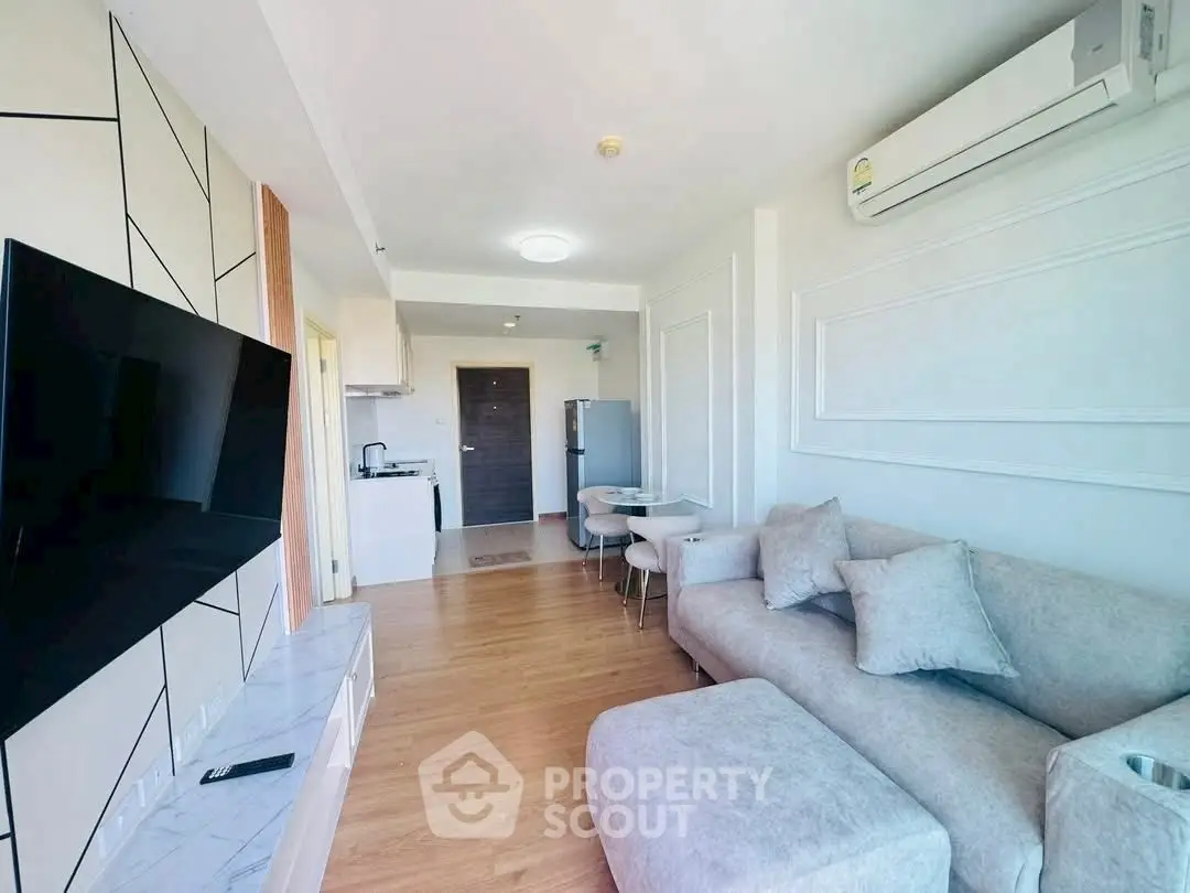 Modern living room with stylish decor and open kitchen layout