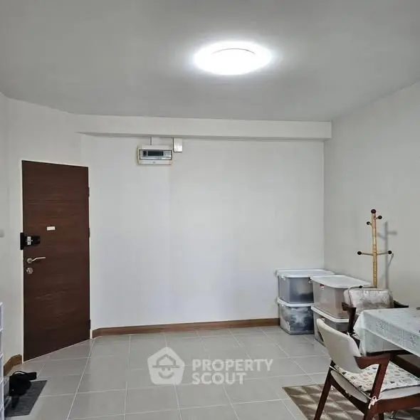 Minimalist interior with dining area and storage boxes, perfect for cozy living.