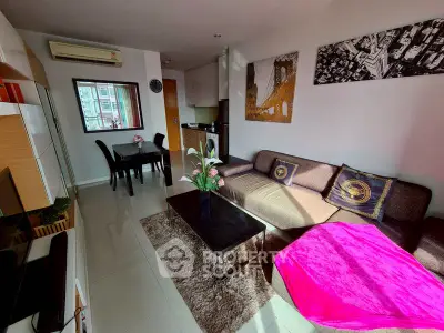 Modern living room with stylish decor and cozy seating area.