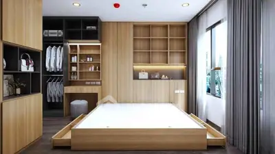 Modern bedroom with built-in storage and large window for natural light