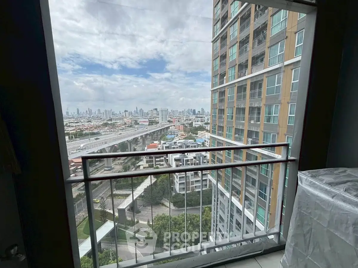 Stunning cityscape view from a modern high-rise balcony, perfect for urban living enthusiasts.