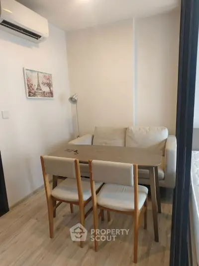 Cozy living room with compact dining area and modern decor