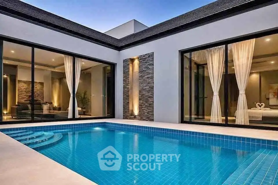 Luxurious modern home with private pool and elegant interior design.