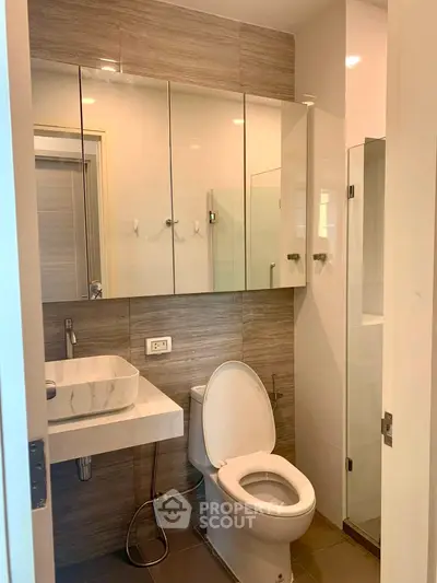 Modern bathroom with sleek fixtures and ample storage space