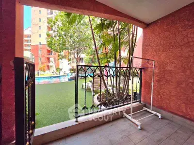 Charming balcony with pool view in vibrant residential complex