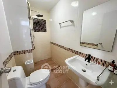 Modern bathroom with stylish tile accents and walk-in shower
