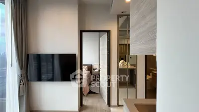 Modern apartment interior with sleek design, featuring a cozy bedroom and stylish living area.