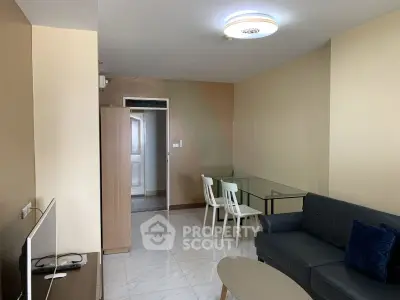 Modern living room with sleek furniture and elegant lighting in a cozy apartment.