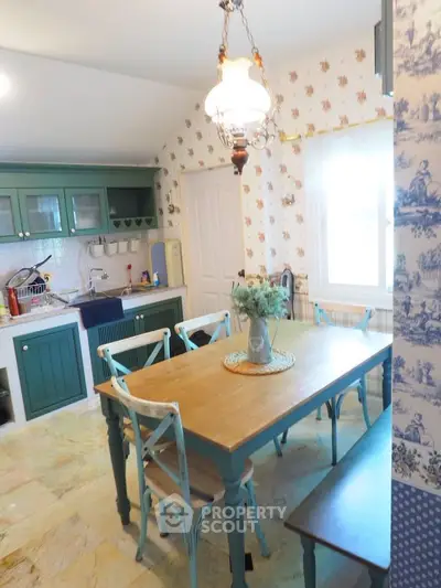 Charming kitchen with vintage decor and wooden dining set in cozy home.