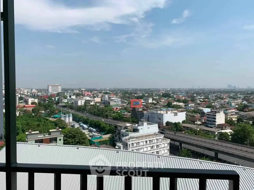 Stunning cityscape view from a high-rise balcony showcasing urban landscape and skyline.