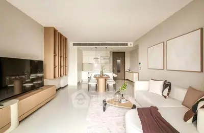 Spacious modern living room with elegant decor and open layout, featuring a cozy seating area and stylish furniture.