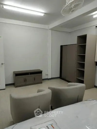 Cozy living room with modern furniture and ample storage space